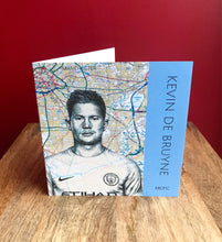 Load image into Gallery viewer, Kevin De Bruyne MCFC Greeting Card. Printed drawing over map of Manchester.Blank inside.

