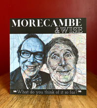 Load image into Gallery viewer, Morecambe and Wise Greeting Card.Printed drawing over maps. Blank inside.
